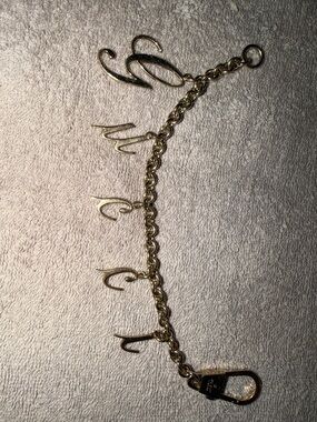 Preloved Gucci Gold Initial bag charm  with Script Letters great condition
